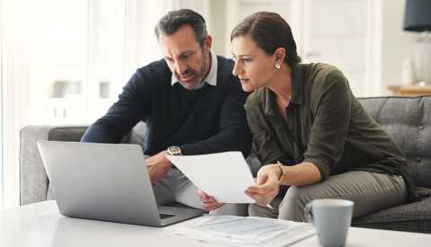 a couple looks over documents