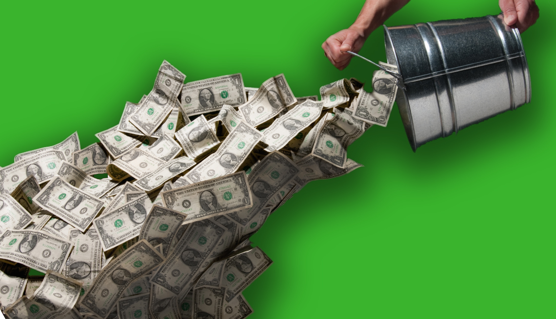 bucket of money being thrown