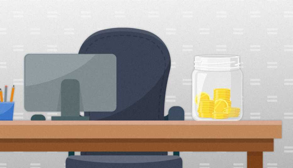workplace desk with chair and monitor and an emergency savings jar on desk