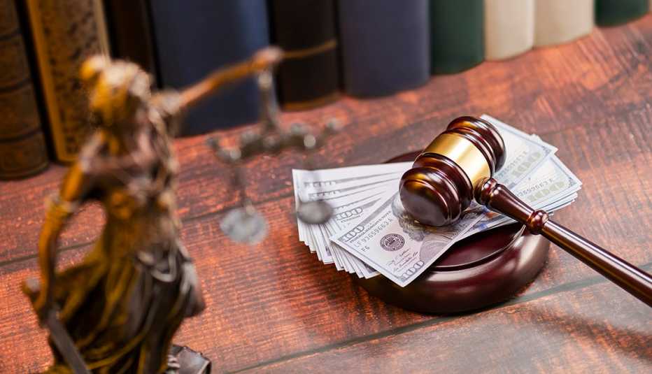 A gavel on a pile of money