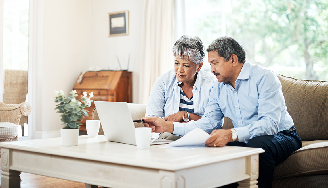 Shot of a senior couple using a laptop together at home