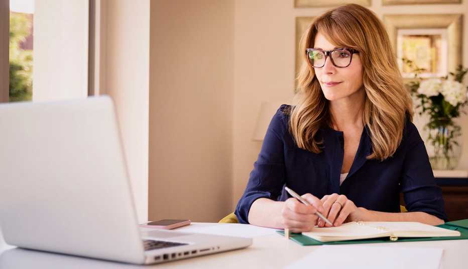 Woman in her 50's doing paperwork