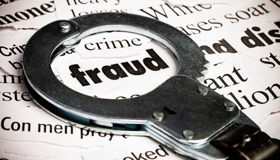 a handcuff circles the word fraud in the middle of a pile of associated words
