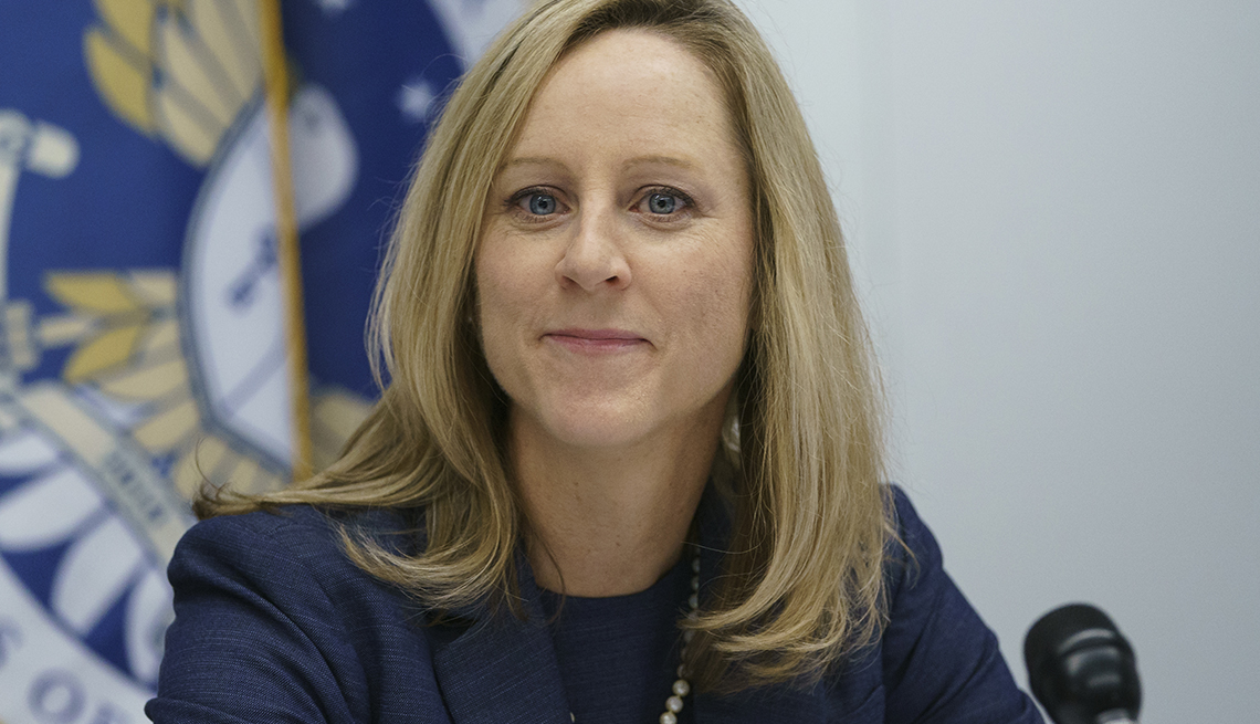 New Bureau of Consumer Financial Protection director Kathy Kraninger pauses as she speaks to media at the Bureau of Consumer Financial Protection offices in Washington, Tuesday, Dec. 11, 2018
