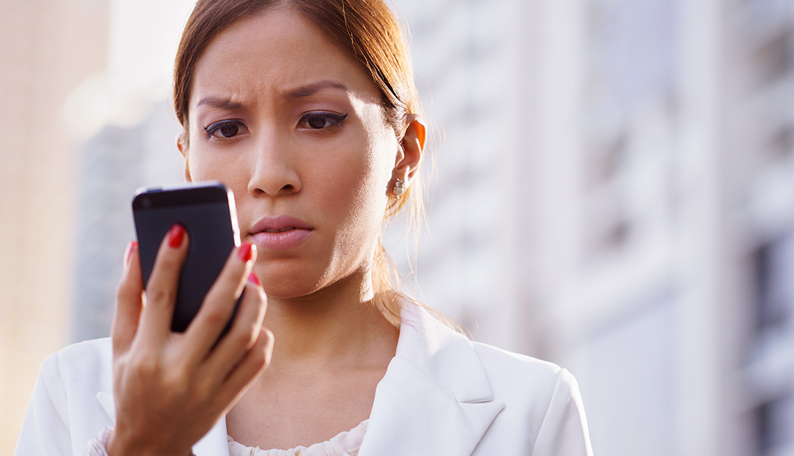 Woman looking mad at her phone 
