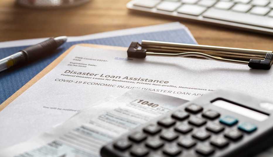 SBA - Small business administration economic injury disaster loan and emergency advance submitted application and tax forms from small business owner applying for relief due to the coronavirus