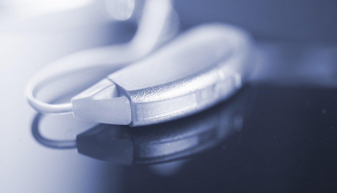 Audiophone modern high technology deafness equipment in the ear digital hearing aid closeup isolated.