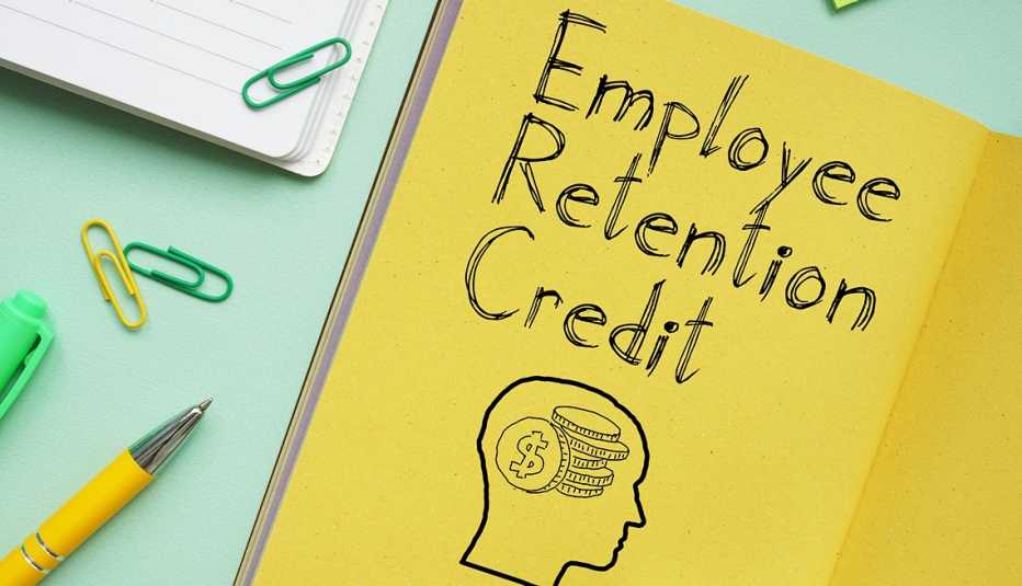 Desktop display with a yellow notepad page that says "Employee Retention Credit"