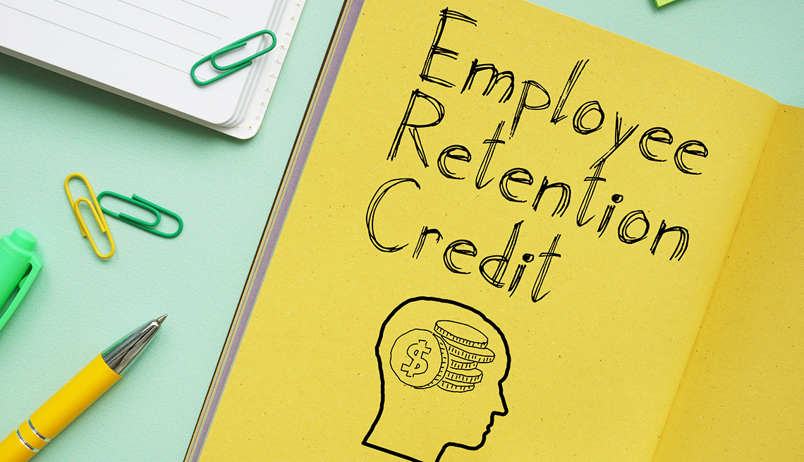 Desktop display with a yellow notepad page that says "Employee Retention Credit"
