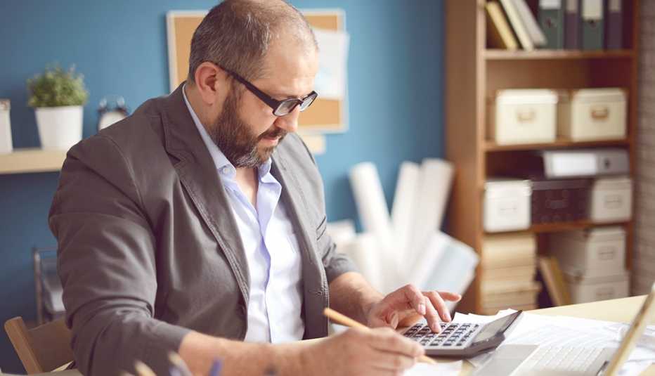A man sitting at his desk working in his home office