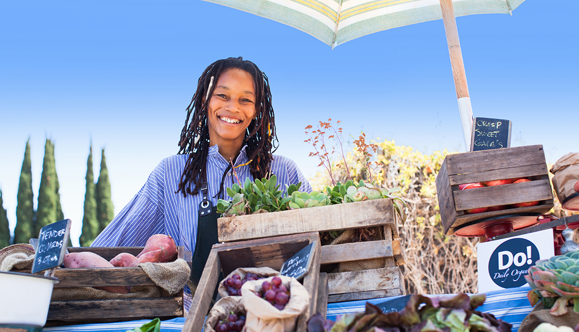  Owner stands at her organic vegetable stand