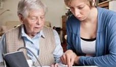 Two woman looking at medication