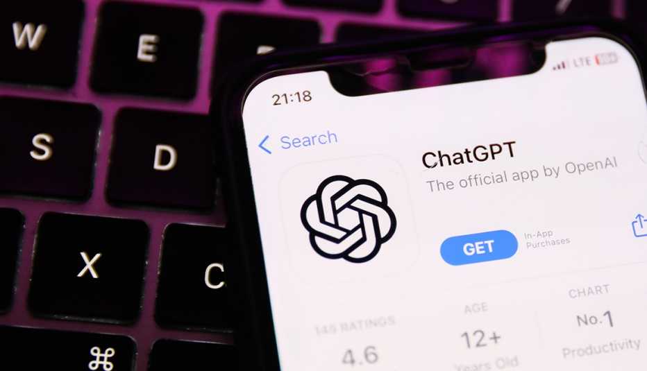 a smartphone displaying chatgpt on top of a keyboard