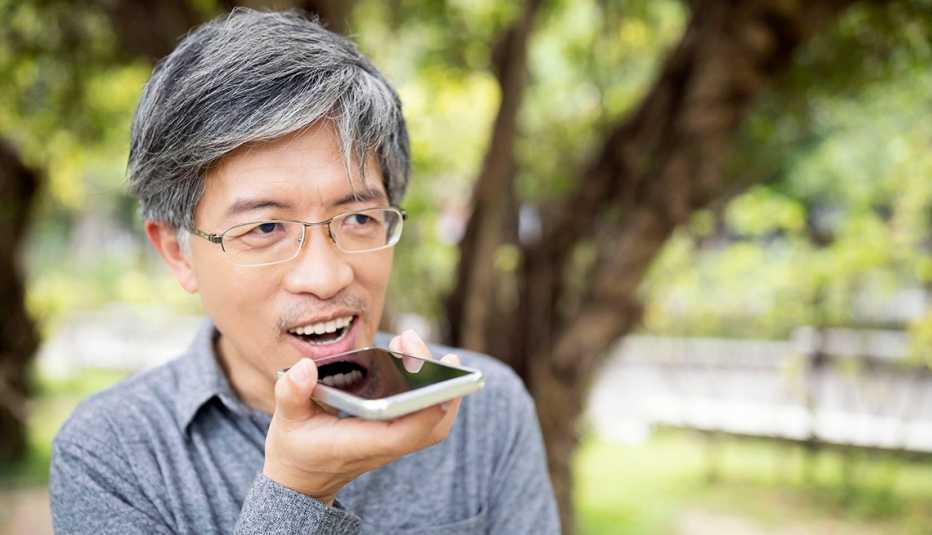 A man is talking to his phone