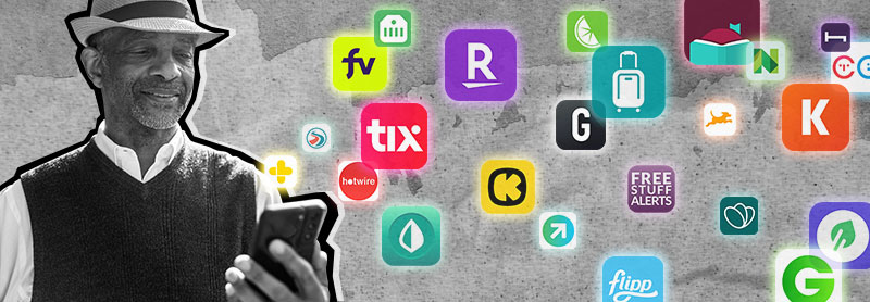 1196765901 a smiling man in a dark vest and a white hat looks at his phone amid floating app logos on a gray field