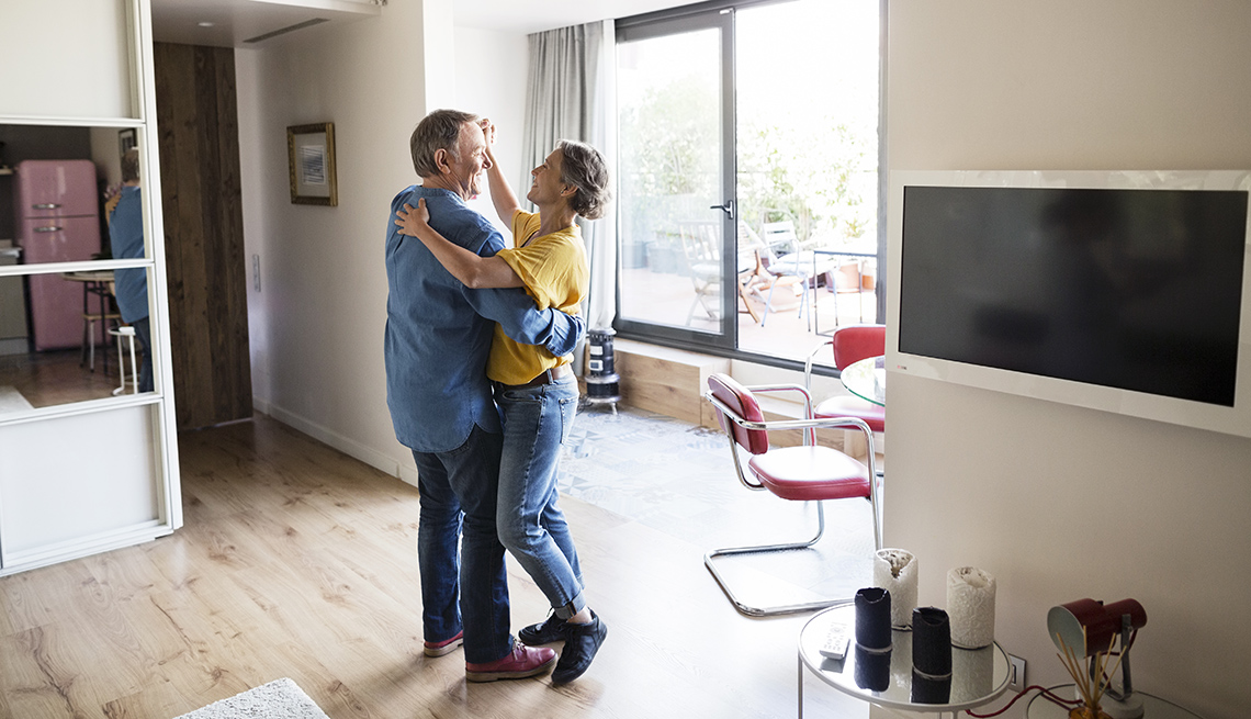 Couple dancing together while listening to music