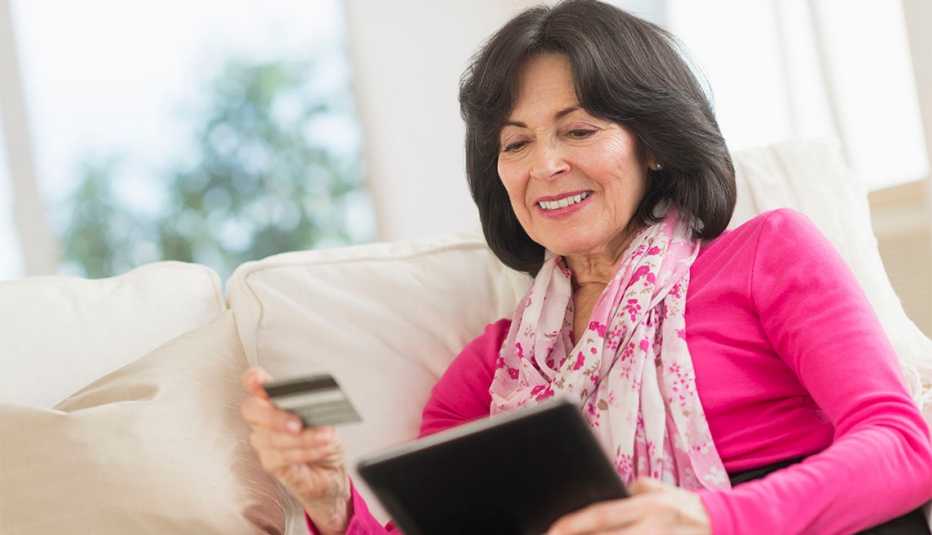 woman shopping online from her couch