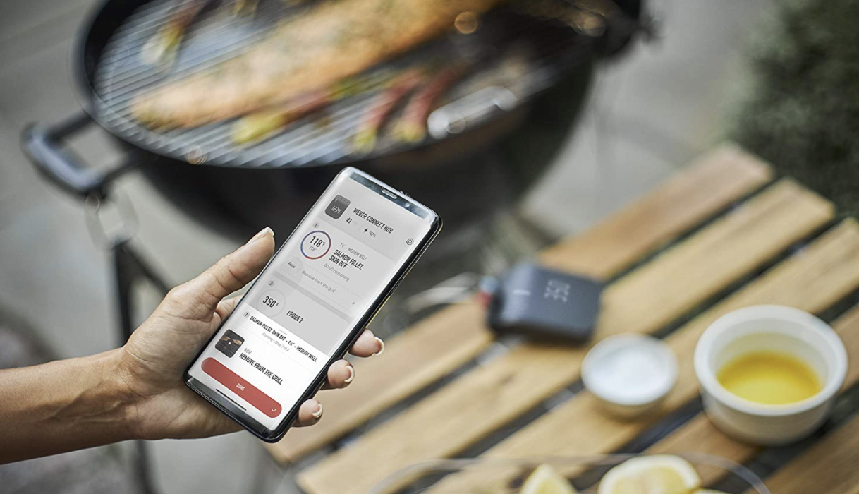 woman using Weber Connect app on her phone