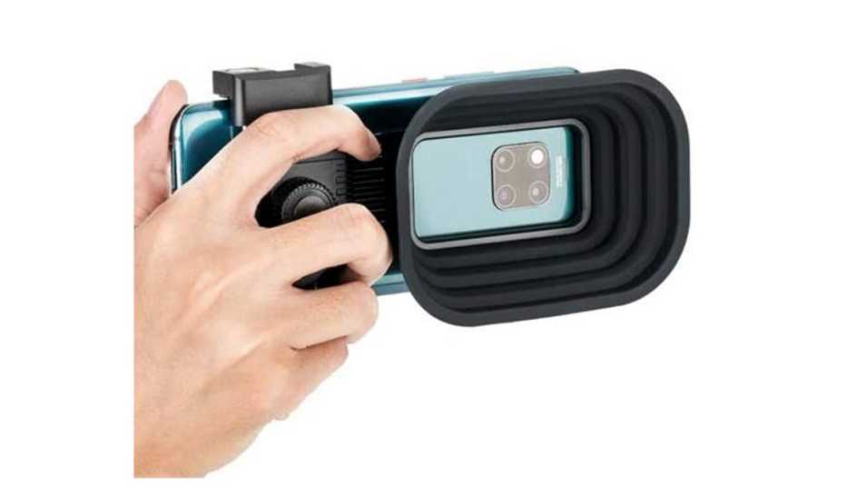 a j c c lens hood attached to a smartphone