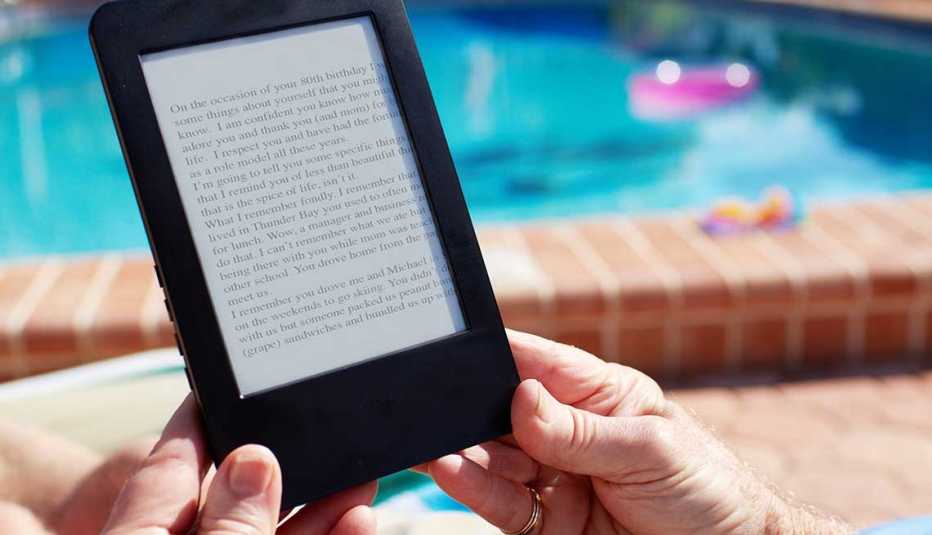 Older adult using an e-book reader