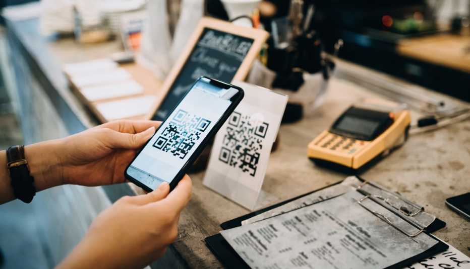 a person scanning a q r code with their smartphone