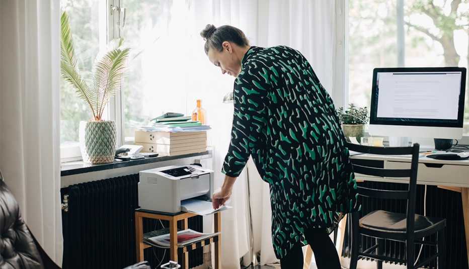 woman printing a document at home