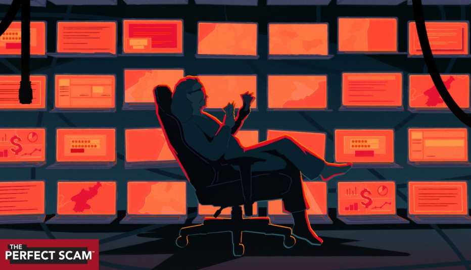 A woman sits in front of a bank of computers