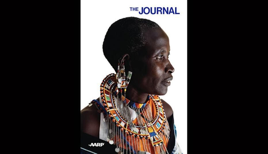 East African woman looking to her side, with "The Journal" above her in blue lettering