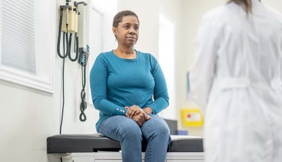 Older woman at a doctor visit Older woman at a doctor visit
