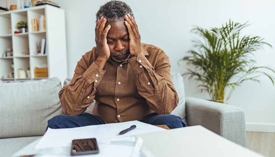 Senior Adult Man With Stacks of Papers and Envelopes
