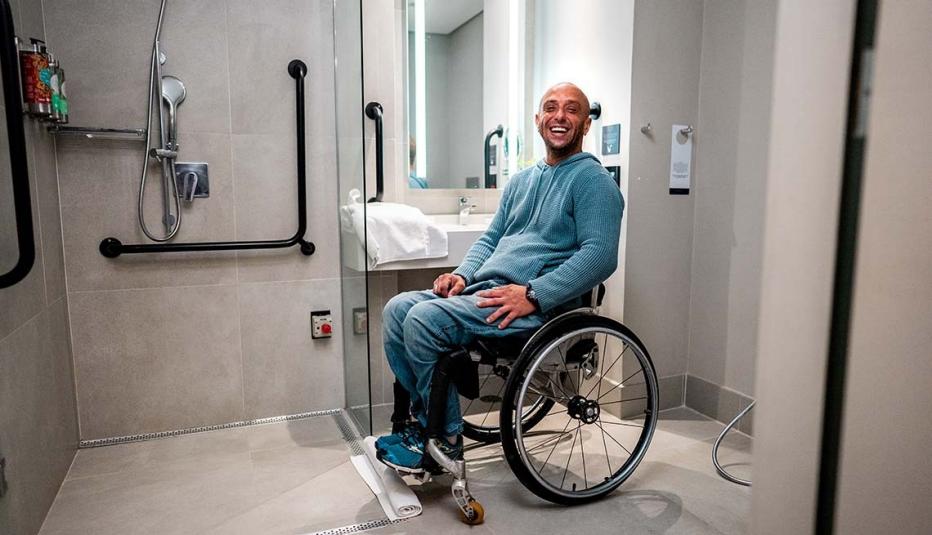 Portrait of a mature wheelchair man in the bathroom