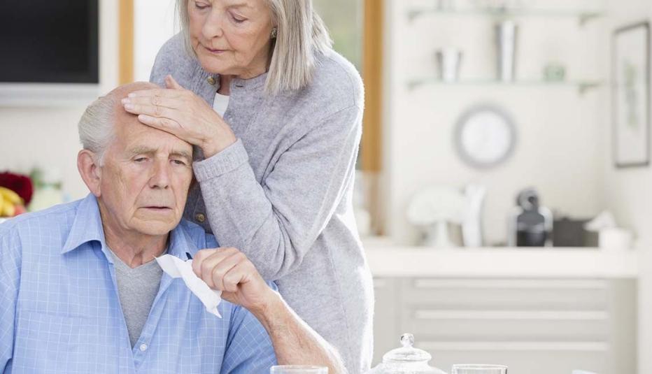 Older woman caring for sick older man Older woman caring for sick older man