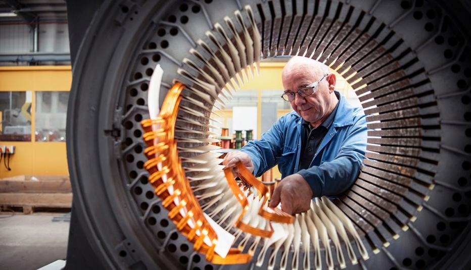 An electrical engineer working on a generator.