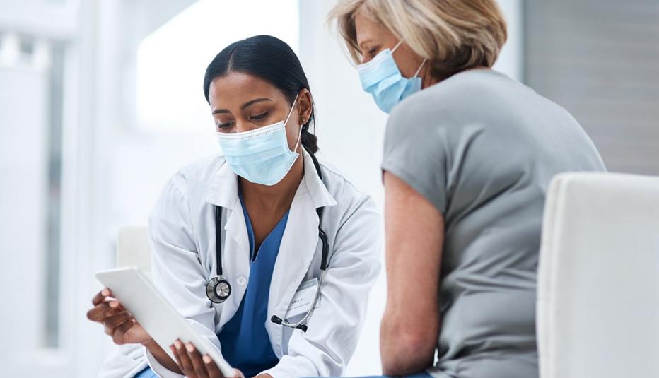 a doctor giving instructions to a female patient a doctor giving instructions to a female patient