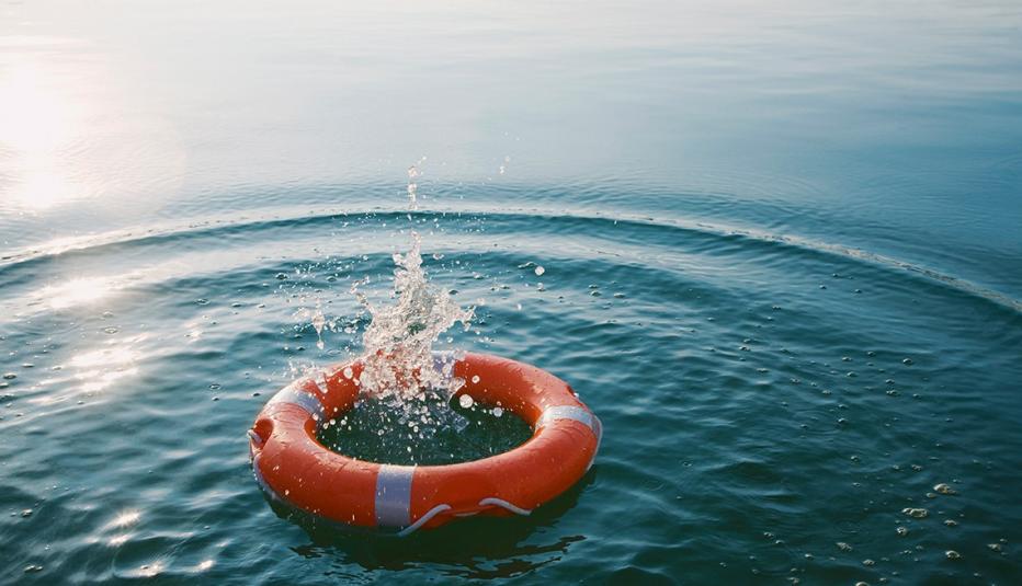 Red life ring in the water