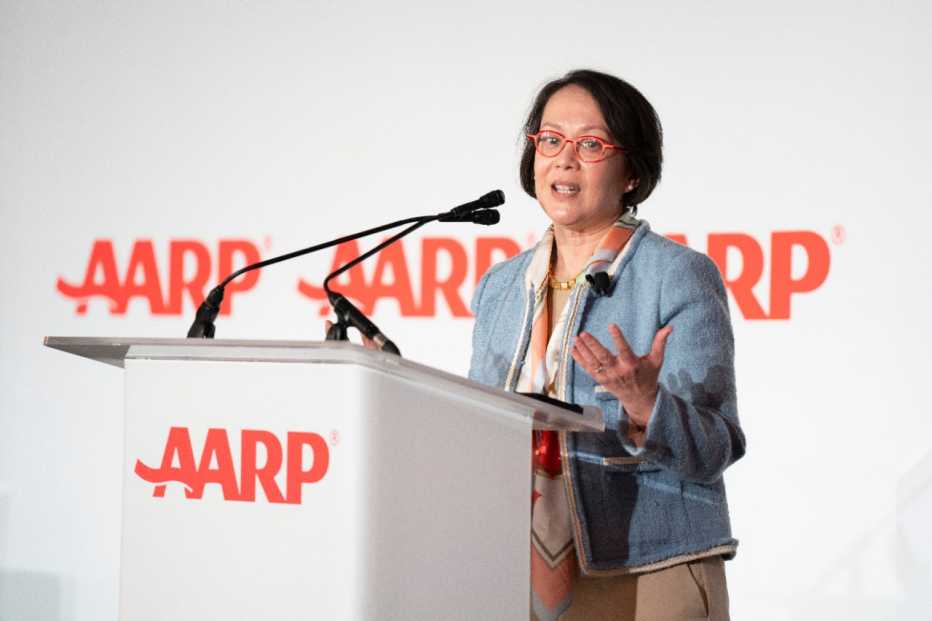 presenter at lectern in front of conference audience
