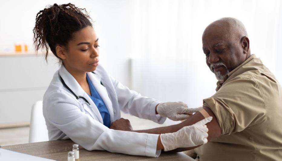 doctor giving patient a vaccine