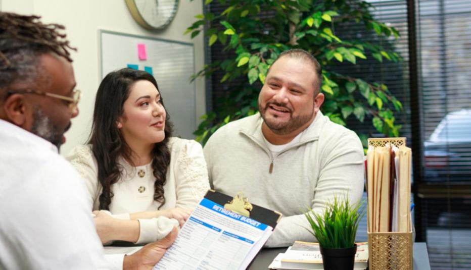 Financial Advising young couple meeting with advisor in an office