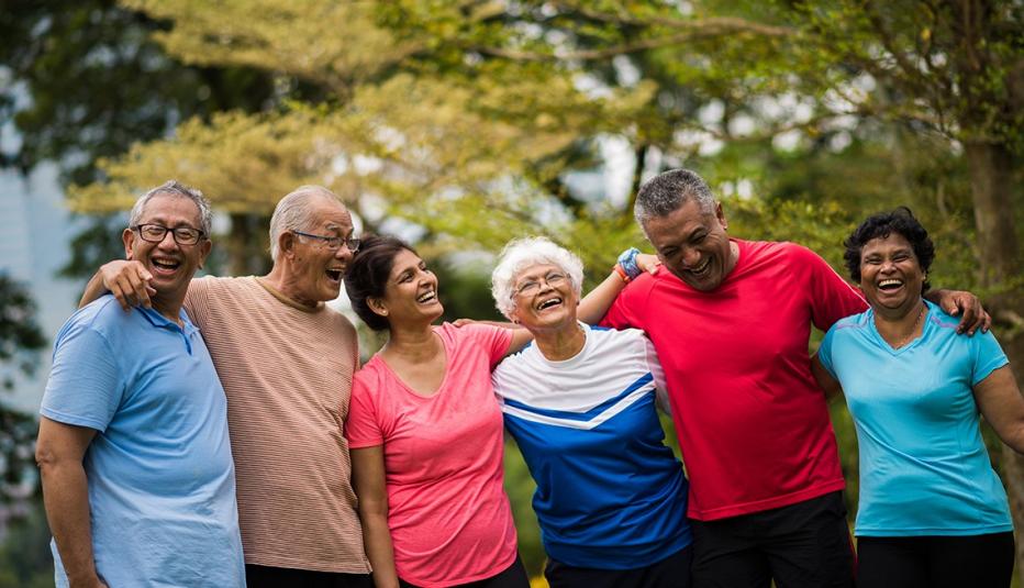 Older Asian American adults laughing in a park Older Asian American adults laughing in a park