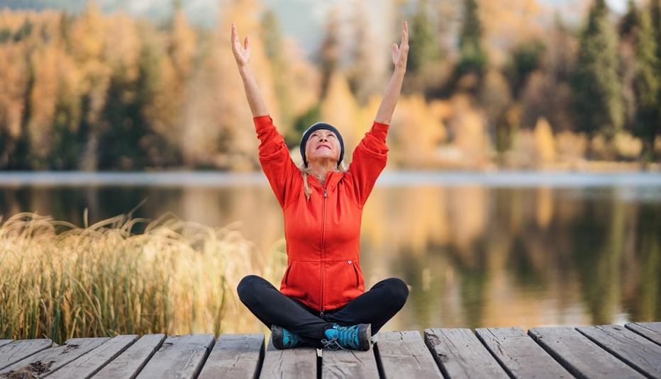 Woman Doing Yoga at the Lake