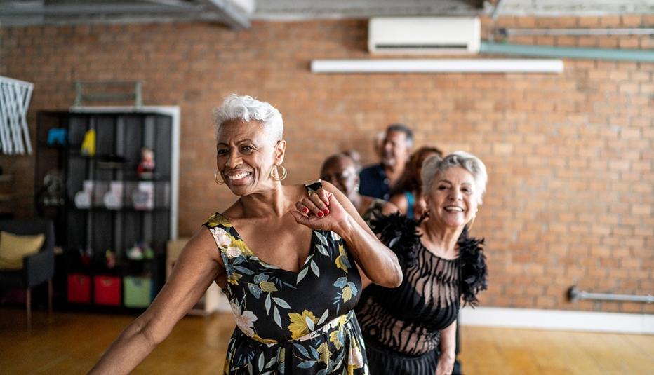 Portrait of senior friends dancing in a dance hall