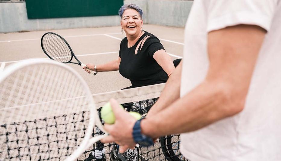 Older woman playing tennis