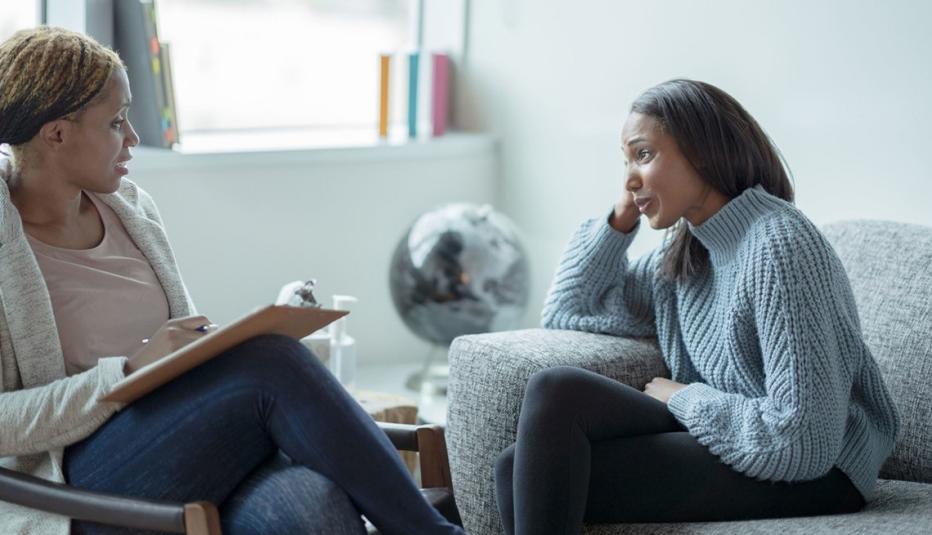 Woman talking to a therapist Woman talking to a therapist