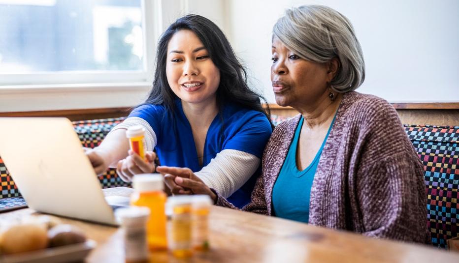 Senior woman having in-home consultation with nurse