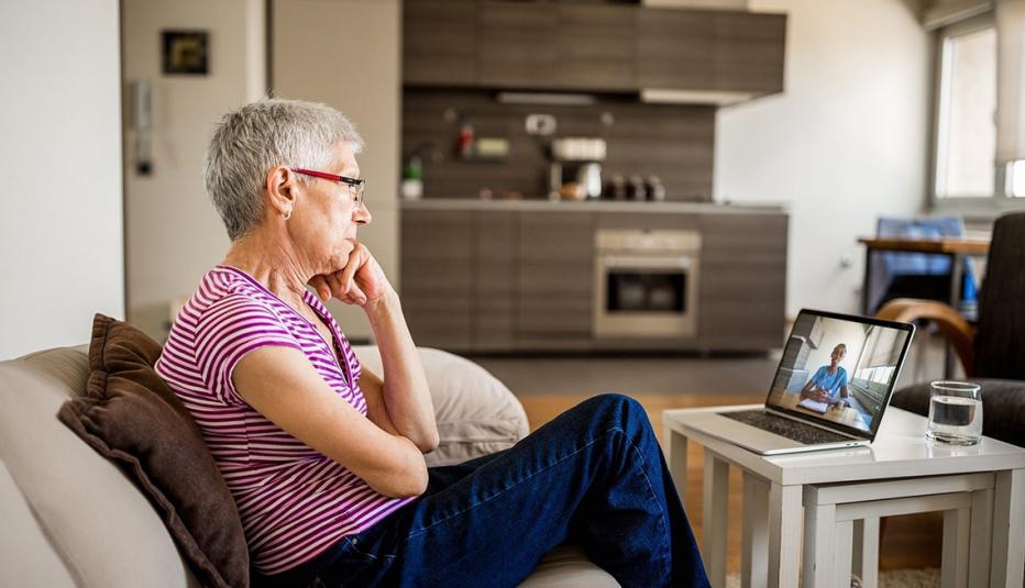 Woman consulting doctor using telehealth