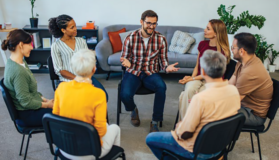 small group of people listening to each other in a circle of chairs