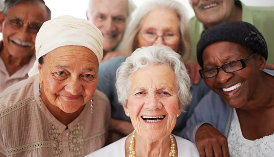 diverse group of older women smiling in group photo