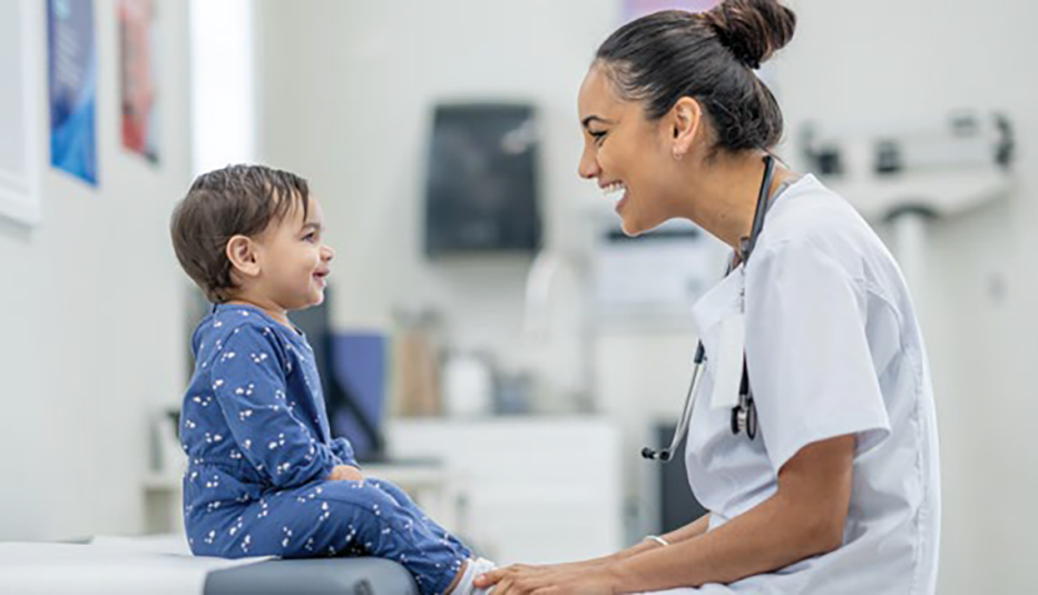 toddler on an exam table in a doctor office
