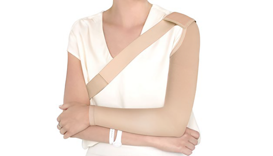 woman with compression sleeve on her left arm, shown from the neck down