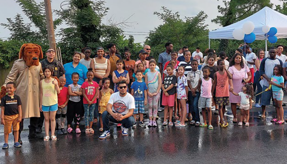 large group of people outside pose for a photo large group of people outside pose for a photo